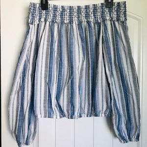 Shoulder-wrap blouse.